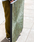 Angled view of the abstract painting showing the depth of its slim black floater frame.