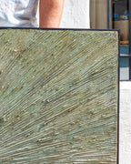Top right corner of the painting, impasto rays in sage and sand meeting the black frame edge.