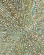 Close detail of the starburst center where the impasto rays converge in sage, sand and pale blue.