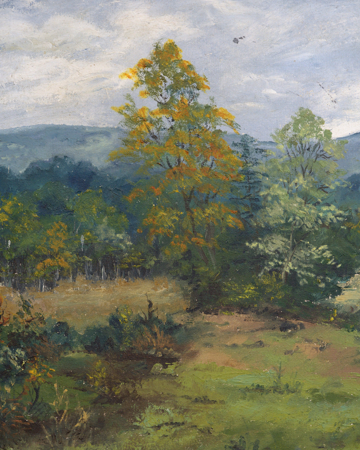 Close detail (trees) of the Sheila Beckley English landscape painting with autumn trees, meadow and blue hills in a striped wood frame.
