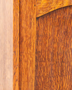 Tight detail of the tiger oak door panel meeting the frame stile, showing dense ray fleck striping.