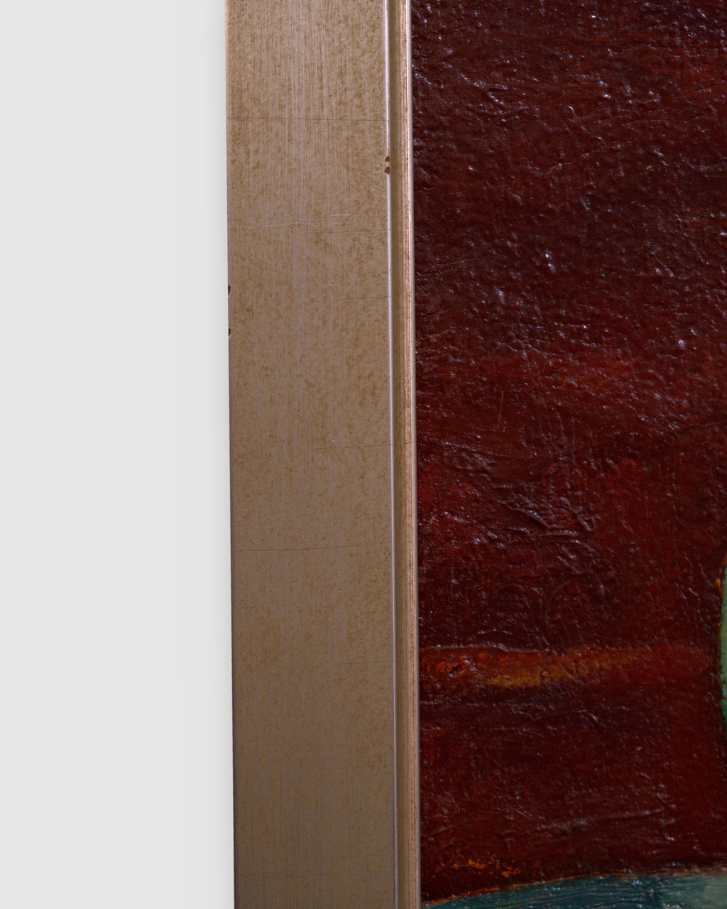 Side view of the frame edge on the Pietro Bugiani still life of watermelon, a blue and white pitcher and a pear in a silver frame.