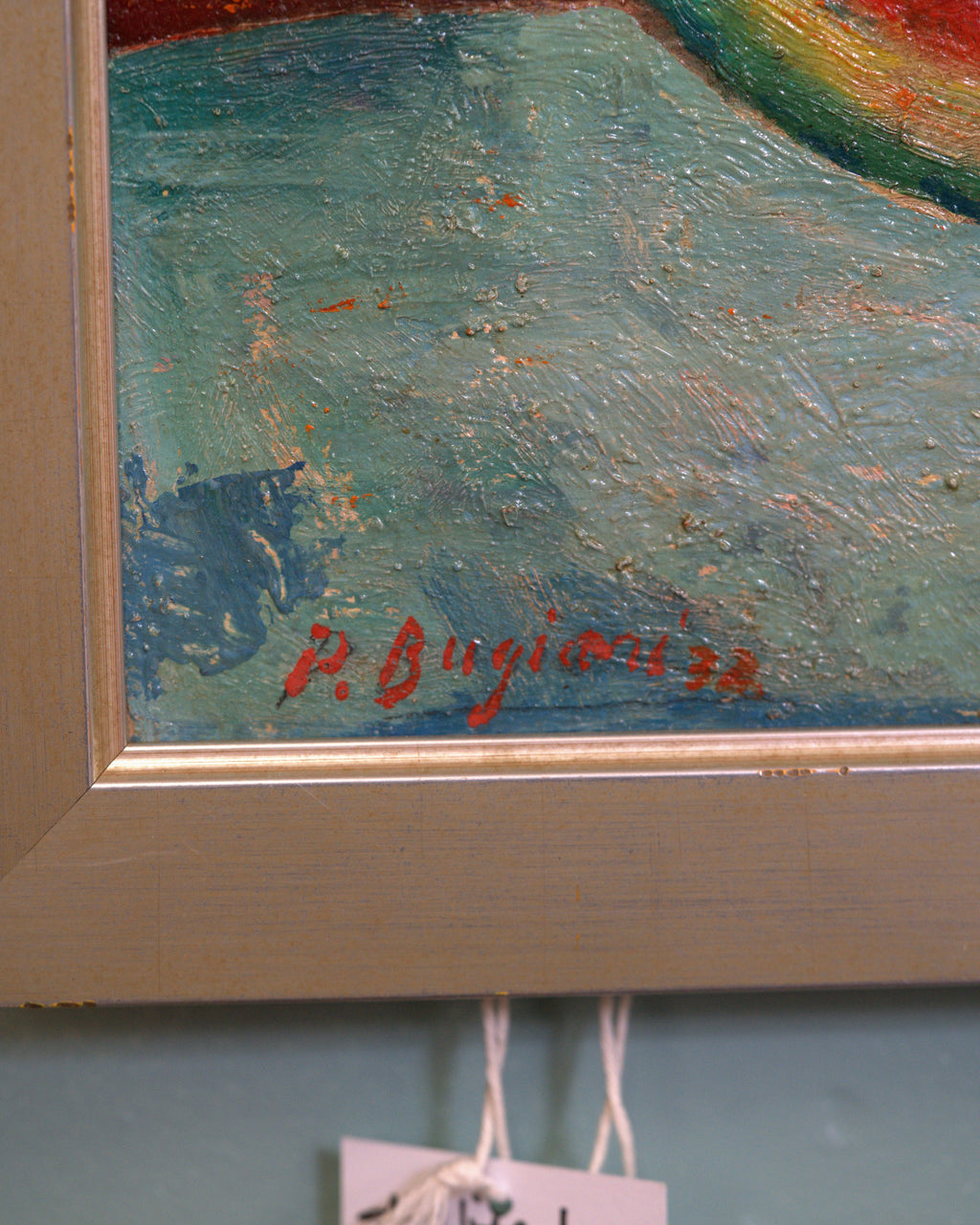 Detail of the signature on the Pietro Bugiani still life of watermelon, a blue and white pitcher and a pear in a silver frame.