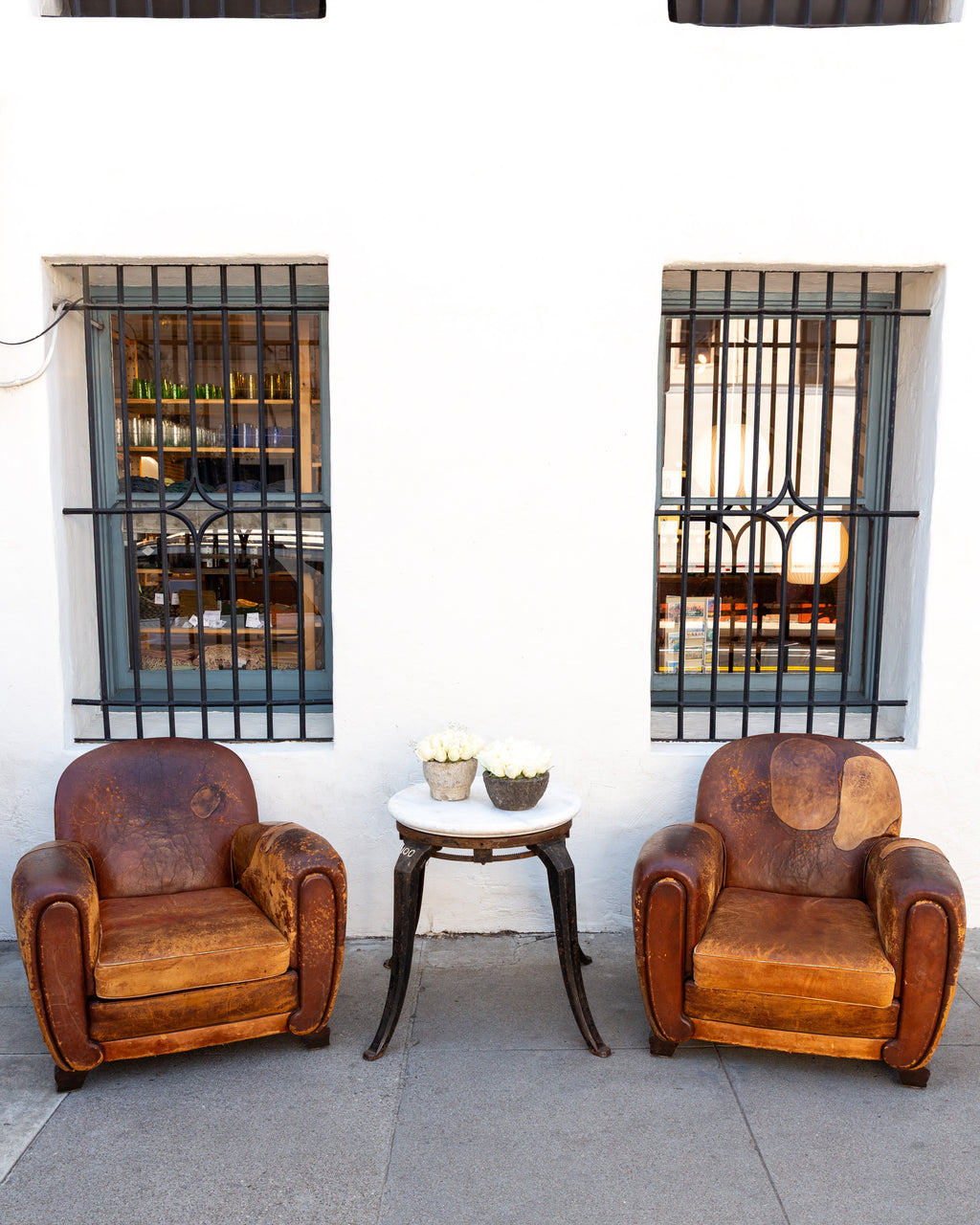 Pair of 1920's French Club Chairs with Leather Patches