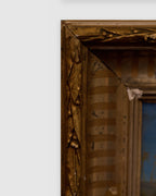 Corner of the frame on the small Italian landscape of a hilltop villa and cypresses in a carved gilt and silver frame.