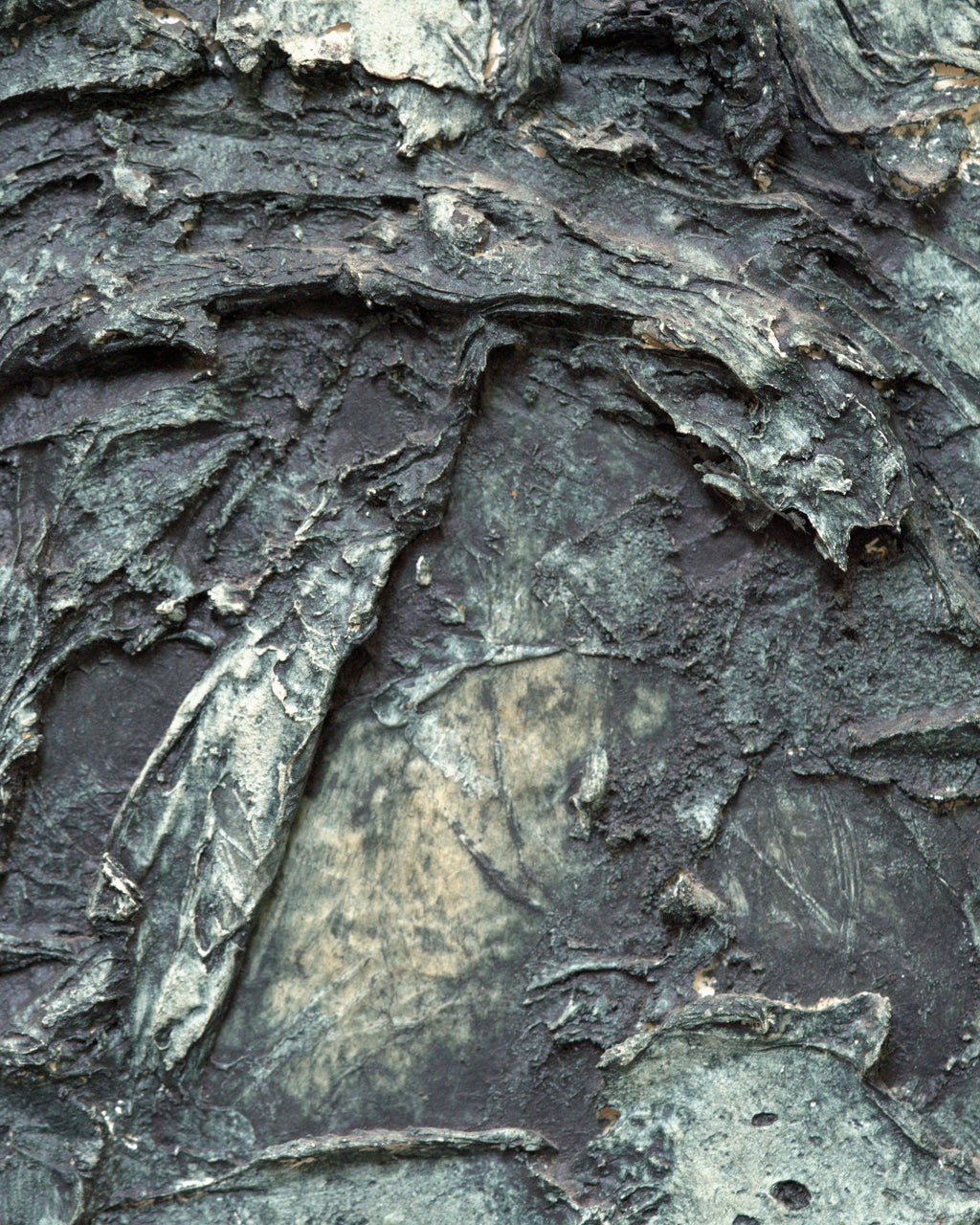 Close detail (relief) of the Ray Jacobsen 1966 plaster relief abstract in slate blue, cream and olive in a silver strip frame.