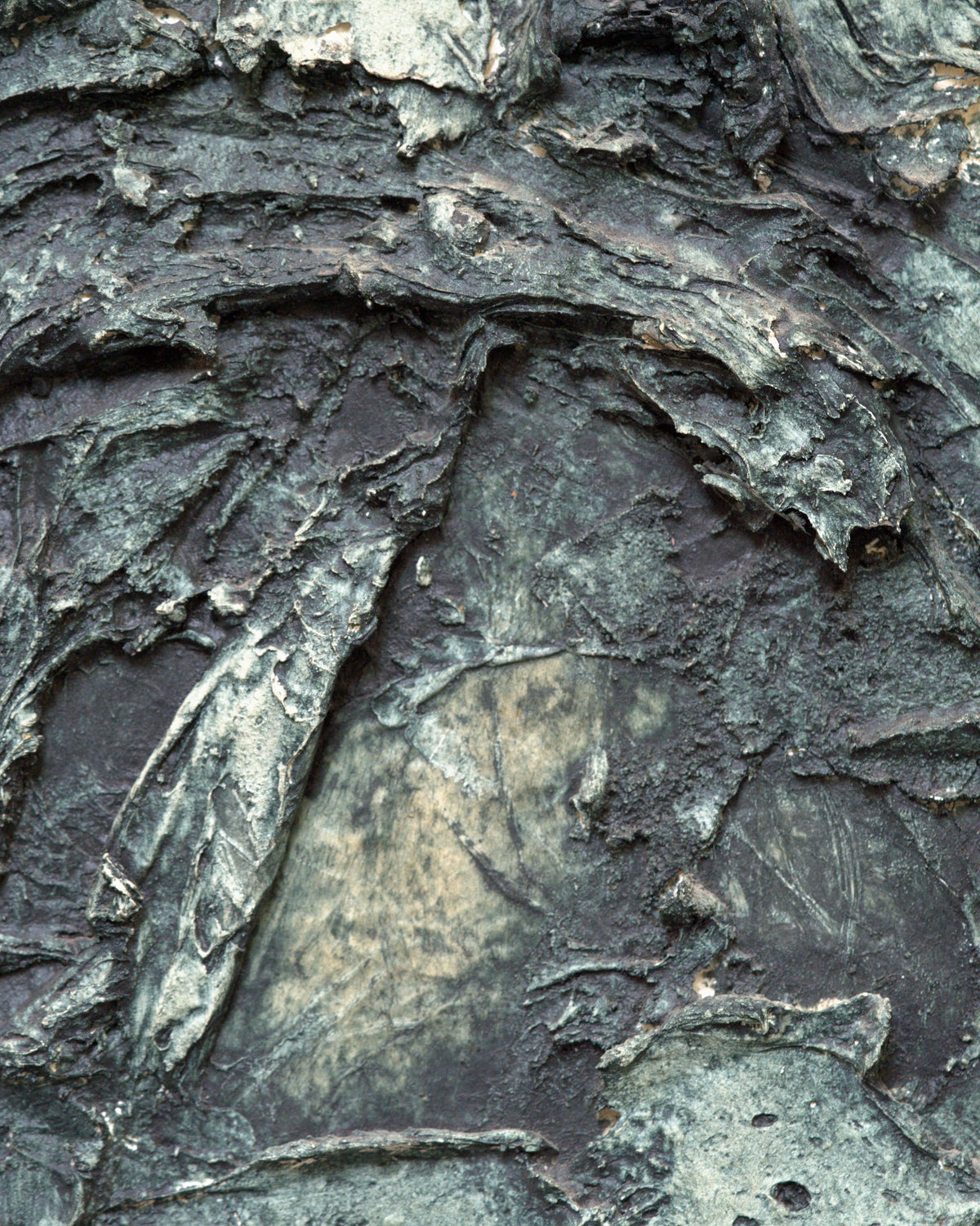 Close detail (relief) of the Ray Jacobsen 1966 plaster relief abstract in slate blue, cream and olive in a silver strip frame.