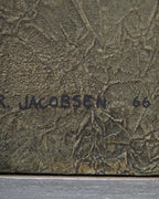 Detail of the signature on the Ray Jacobsen 1966 plaster relief abstract in slate blue, cream and olive in a silver strip frame.