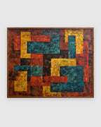 Straight-on view of a mid century geometric abstract painting in red, mustard and teal impasto in a narrow wood frame, on a light gray background.
