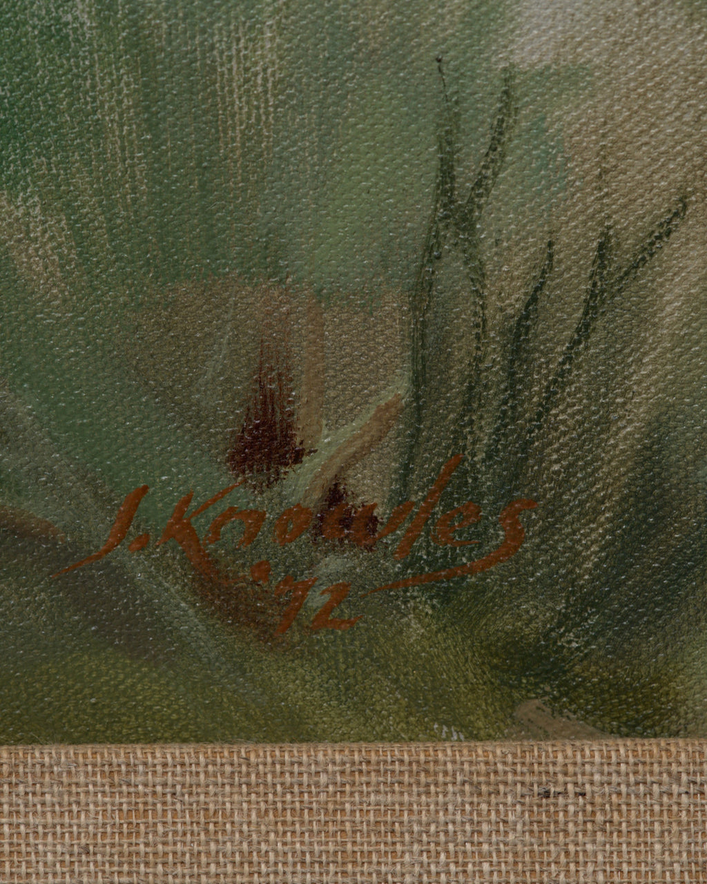 Detail of the signature on the Joseph Knowles California desert landscape with lavender mountains and rabbitbrush in a gray frame with linen liner.
