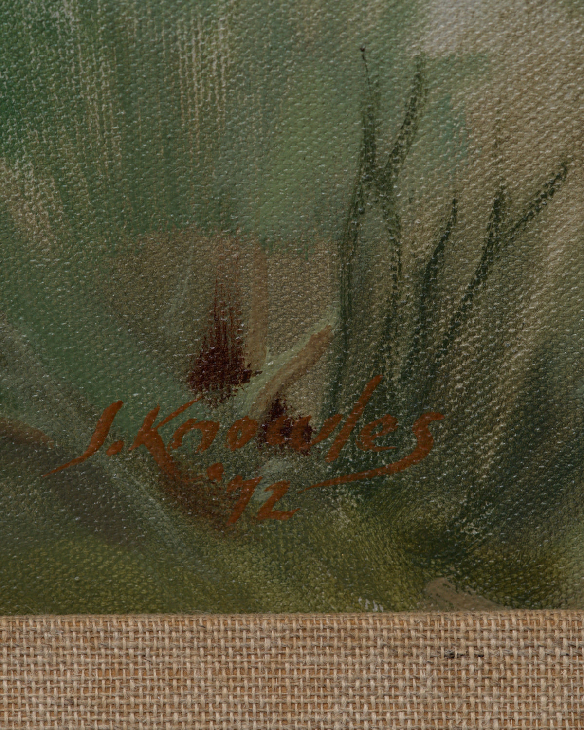 Detail of the signature on the Joseph Knowles California desert landscape with lavender mountains and rabbitbrush in a gray frame with linen liner.