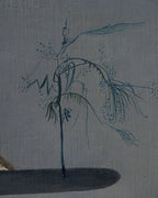 Close detail (sprig) of the F. Luccardi 1950s surrealist painting with a dark central stand and collage-like shapes on gray, in a black and gilt frame.