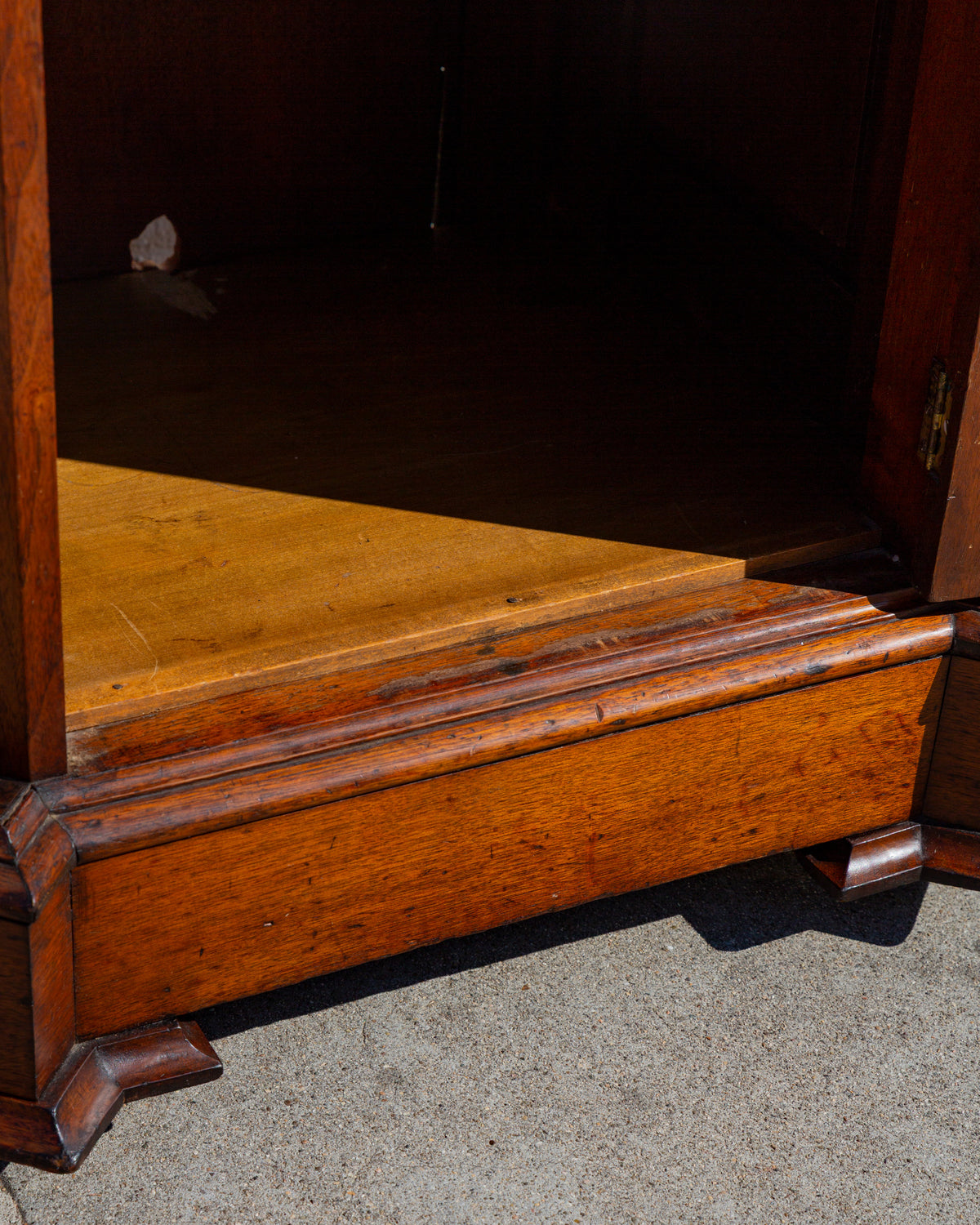 Detail of the interior shelf and molded plinth with the door open