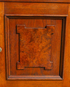Detail of the applied burl walnut panel on the cupboard door, cut in a stepped Eastlake shape, with a shrinkage split through the burl