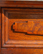Close detail of the stepped burl walnut panel applied to the drawer front