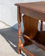 Detail of the molded oak top edge, turned leg and end panel of a side table