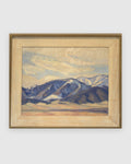 Straight-on view of a Lee Fritz Randolph painting of a blue snow-streaked mountain range above an ochre plain in a natural wood frame, on a light gray background.