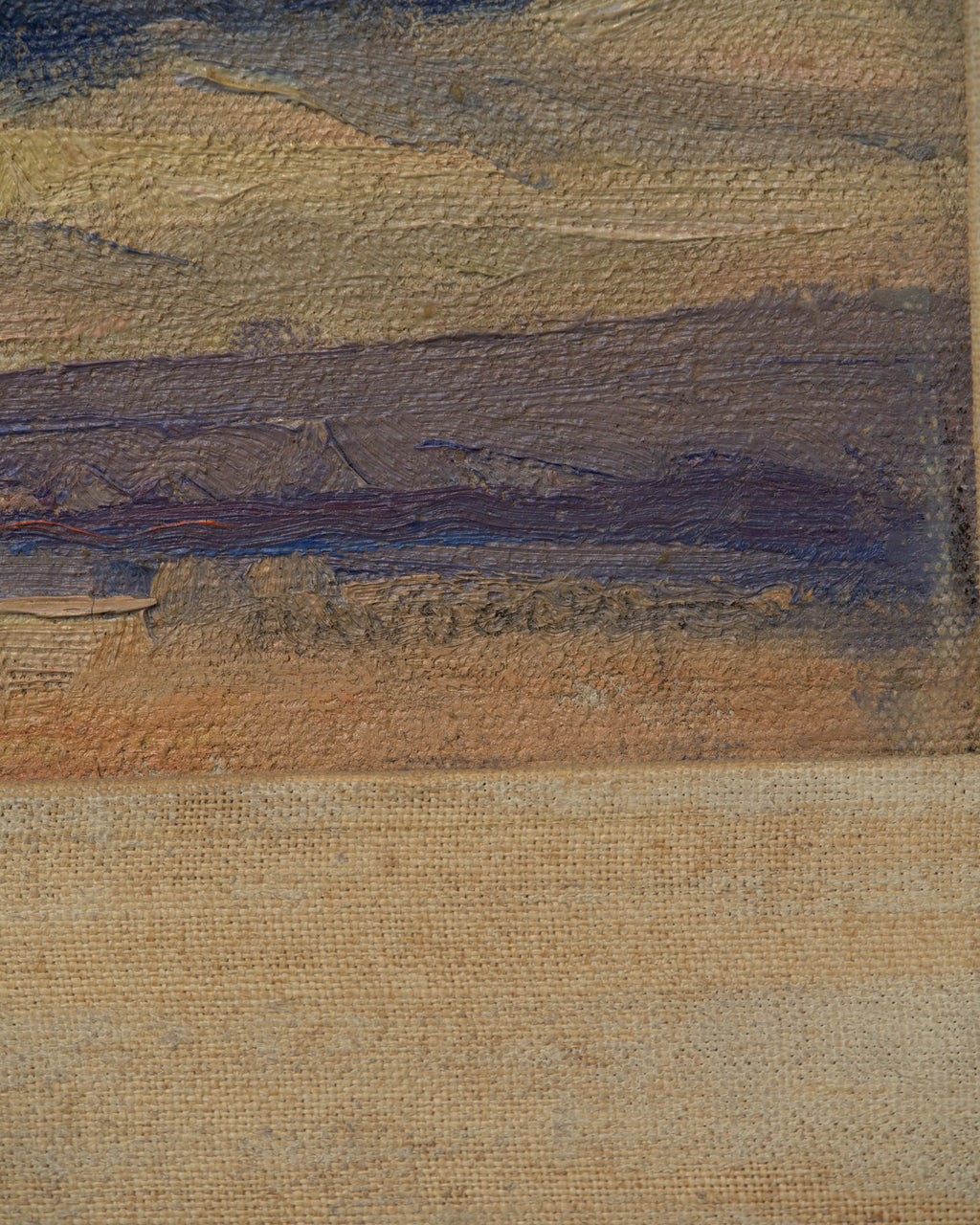 Detail of the signature on the Lee Fritz Randolph painting of a blue snow-streaked mountain range above an ochre plain in a natural wood frame.