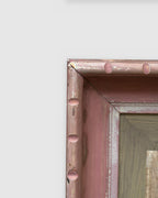 Corner of the frame on the Avram Rubenstein abstraction of a pale bird in chalky white and rust in a pink bamboo-style frame.