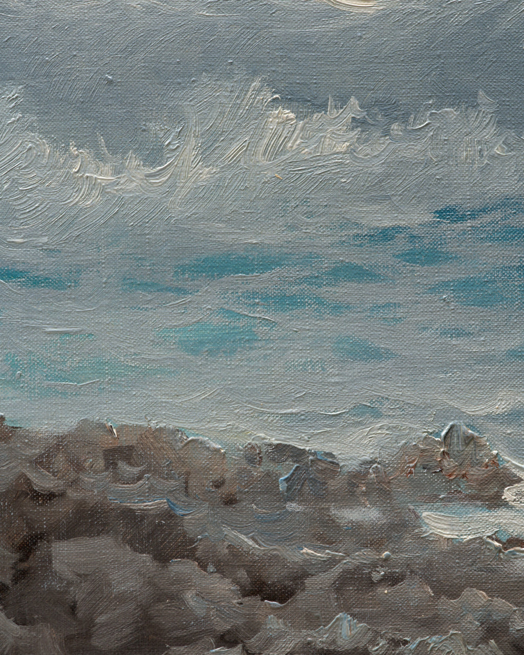 Close detail (rocks) of the 1960s seascape of turquoise breaking waves, rocks and a misty headland in a whitewashed frame with linen liner.