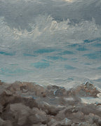 Close detail (rocks) of the 1960s seascape of turquoise breaking waves, rocks and a misty headland in a whitewashed frame with linen liner.
