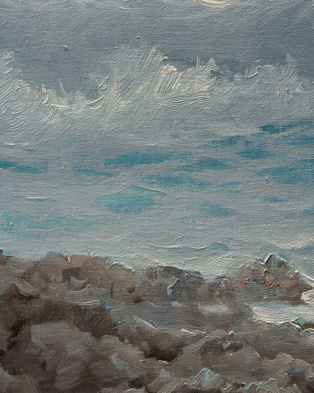 Close detail (rocks) of the 1960s seascape of turquoise breaking waves, rocks and a misty headland in a whitewashed frame with linen liner.