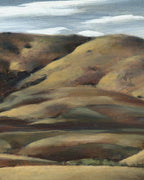 Close detail (hills) of the Milford Zornes painting Hills of Nipomo, golden rolling hills under gray clouds, in a wide limed wood frame.